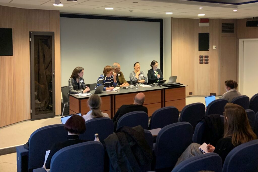 Image of the panelists and moderator during the discussion.