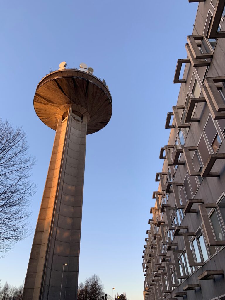 Photograph of the VRT broadcast tower and offices.